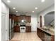 Spacious kitchen with stainless steel appliances, tiled floor and light wood cabinets at 11511 Wilson Mill Ln, Pineville, NC 28134
