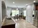 Bright kitchen and dining area featuring stainless steel appliances and plenty of natural light at 11511 Wilson Mill Ln, Pineville, NC 28134