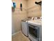 Laundry room featuring a side-by-side washer and dryer and wire shelving at 11511 Wilson Mill Ln, Pineville, NC 28134