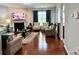 Comfortable living room with hardwood floors, fireplace, and stylish seating at 11511 Wilson Mill Ln, Pineville, NC 28134
