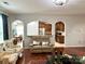 Living room showcasing hardwood floors and views of the kitchen and dining area at 11511 Wilson Mill Ln, Pineville, NC 28134