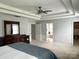 Spacious main bedroom with a tray ceiling and ensuite bathroom with walk in closet at 11511 Wilson Mill Ln, Pineville, NC 28134