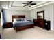 Spacious main bedroom with tray ceilings, ceiling fan, carpeting, and ample closet space at 11511 Wilson Mill Ln, Pineville, NC 28134