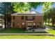 Well-maintained brick home with a patio, fire pit, and grassy backyard at 121 Canterbury Xing, Fort Mill, SC 29708