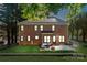 Brick home with a cozy patio, fire pit, and well-lit grassy backyard at 121 Canterbury Xing, Fort Mill, SC 29708