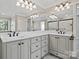 En-suite bathroom with double vanity, a large mirror, and decorative lights at 121 Canterbury Xing, Fort Mill, SC 29708