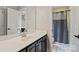 Stylish bathroom featuring a vanity with black cabinets, a large mirror, and a shower at 121 Canterbury Xing, Fort Mill, SC 29708
