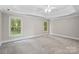Large bedroom with tray ceiling, neutral walls, and plush carpeting at 121 Canterbury Xing, Fort Mill, SC 29708