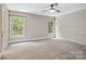 Bright bedroom with large windows and an accent wall, offering a serene atmosphere at 121 Canterbury Xing, Fort Mill, SC 29708