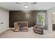 Cozy Bedroom with a wood crib, comfortable chair, stylish ceiling fan, and unique dark accent wall at 121 Canterbury Xing, Fort Mill, SC 29708
