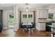 Dining area features hardwood floors, modern light fixture and outdoor view at 121 Canterbury Xing, Fort Mill, SC 29708