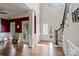 Inviting foyer with hardwood floors, staircase, and abundant natural light at 121 Canterbury Xing, Fort Mill, SC 29708
