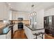 Spacious kitchen featuring stainless steel appliances, center island, and ample cabinet space at 121 Canterbury Xing, Fort Mill, SC 29708