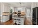 Spacious kitchen featuring stainless steel appliances, center island, and ample cabinet space at 121 Canterbury Xing, Fort Mill, SC 29708