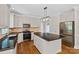 Modern kitchen featuring granite counters, stainless steel appliances, and center island at 121 Canterbury Xing, Fort Mill, SC 29708