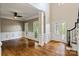 Bright and airy living room boasts hardwood floors, wainscoting, and large windows at 121 Canterbury Xing, Fort Mill, SC 29708