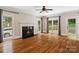 Cozy living room with fireplace, hardwood floors, and ample natural light at 121 Canterbury Xing, Fort Mill, SC 29708