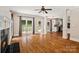 Open living room featuring a fireplace, hardwood floors, and neutral wall colors at 121 Canterbury Xing, Fort Mill, SC 29708