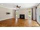 Spacious living room with fireplace, hardwood floors, and abundant natural light at 121 Canterbury Xing, Fort Mill, SC 29708