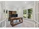 Bright office with a large desk, built-in bookshelf, and ample natural light at 121 Canterbury Xing, Fort Mill, SC 29708