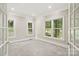 Bright office space with carpeted floors and glass french doors providing ample natural light at 121 Canterbury Xing, Fort Mill, SC 29708