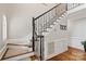 Elegant staircase with decorative iron railings and hardwood floors in a well-lit foyer at 121 Canterbury Xing, Fort Mill, SC 29708