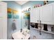 Well-lit bathroom with vanity, wall art, and decorative storage shelves adding character and functionality at 1288 Shenandoah Cir, Rock Hill, SC 29730