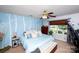 Charming bedroom featuring blue walls with tree decals, a ceiling fan, and a comfortable bed with decorative pillows at 1288 Shenandoah Cir, Rock Hill, SC 29730