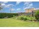 A backyard with a garden that provides a peaceful outdoor space for relaxation at 1300 Reece Rd # 206, Charlotte, NC 28209