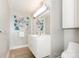 Bathroom featuring a modern sink with artistic decorations, and neutral decor at 1300 Reece Rd # 206, Charlotte, NC 28209