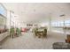 A well-lit common room with comfortable seating areas and ample space at 1300 Reece Rd # 206, Charlotte, NC 28209