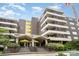 Multi-story brick building with balconies and covered entry at 1300 Reece Rd # 206, Charlotte, NC 28209