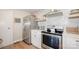 A well-lit kitchen featuring stainless steel appliances and a white countertop at 1300 Reece Rd # 206, Charlotte, NC 28209