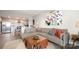 Open concept living room and kitchen area with modern decor and natural light at 1300 Reece Rd # 206, Charlotte, NC 28209