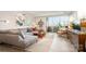 Comfortable living room featuring a sliding glass door to a patio, soft gray sofa, and wood accents at 1300 Reece Rd # 206, Charlotte, NC 28209
