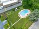 A beautiful aerial view of the pool surrounded by lush landscaping and community gardens at 1300 Reece Rd # 206, Charlotte, NC 28209