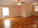 Bedroom with hardwood floors, a ceiling fan, and natural light from the windows at 1302 Devonmere Pl, Salisbury, NC 28144