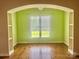 This room has built-in shelves, hardwood floors, and a window with white blinds at 1302 Devonmere Pl, Salisbury, NC 28144