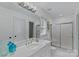 Bright bathroom with marble countertop, white cabinets and a glass shower at 1317 Longleaf Ct, Matthews, NC 28104