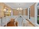 Refined dining room with a stylish chandelier, elegant furniture, and a serene ambiance at 1317 Longleaf Ct, Matthews, NC 28104