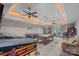 Spacious game room with multiple game tables and a seating area, perfect for entertaining friends and Gathering at 1317 Longleaf Ct, Matthews, NC 28104