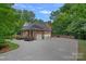 Spacious three-car garage with a large driveway, offering ample parking and convenience at 1317 Longleaf Ct, Matthews, NC 28104