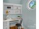 Cozy home office space with built-in shelves and natural light from octagon window at 1317 Longleaf Ct, Matthews, NC 28104