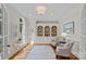 Bright home office with built-in bookshelves, a large window, and stylish furnishings at 1317 Longleaf Ct, Matthews, NC 28104