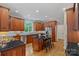 Kitchen with granite countertops, island with seating, and stainless steel appliances at 1317 Longleaf Ct, Matthews, NC 28104