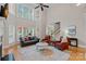 Bright living room with fireplace and large bay windows offering abundant natural light at 1317 Longleaf Ct, Matthews, NC 28104