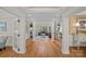 Bright and spacious living room with a fireplace, hardwood floors, and ample natural light at 1317 Longleaf Ct, Matthews, NC 28104