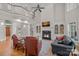 Open-concept living room with a fireplace, soaring ceilings, and access to the upper level at 1317 Longleaf Ct, Matthews, NC 28104