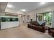 Basement area featuring a large aquarium, living area, and access to the outside at 138 Ardmore Pl, Mooresville, NC 28117