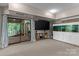 Basement area featuring an aquarium, brick trim, and access to an outdoor staircase at 138 Ardmore Pl, Mooresville, NC 28117